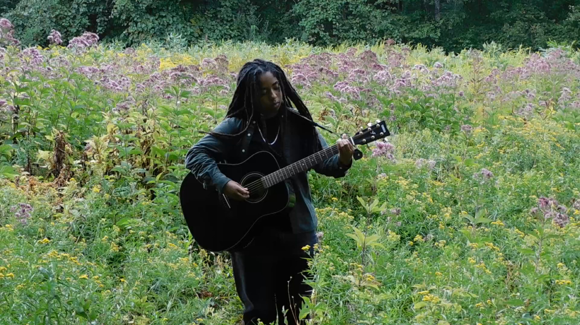 Bailey playing guitar