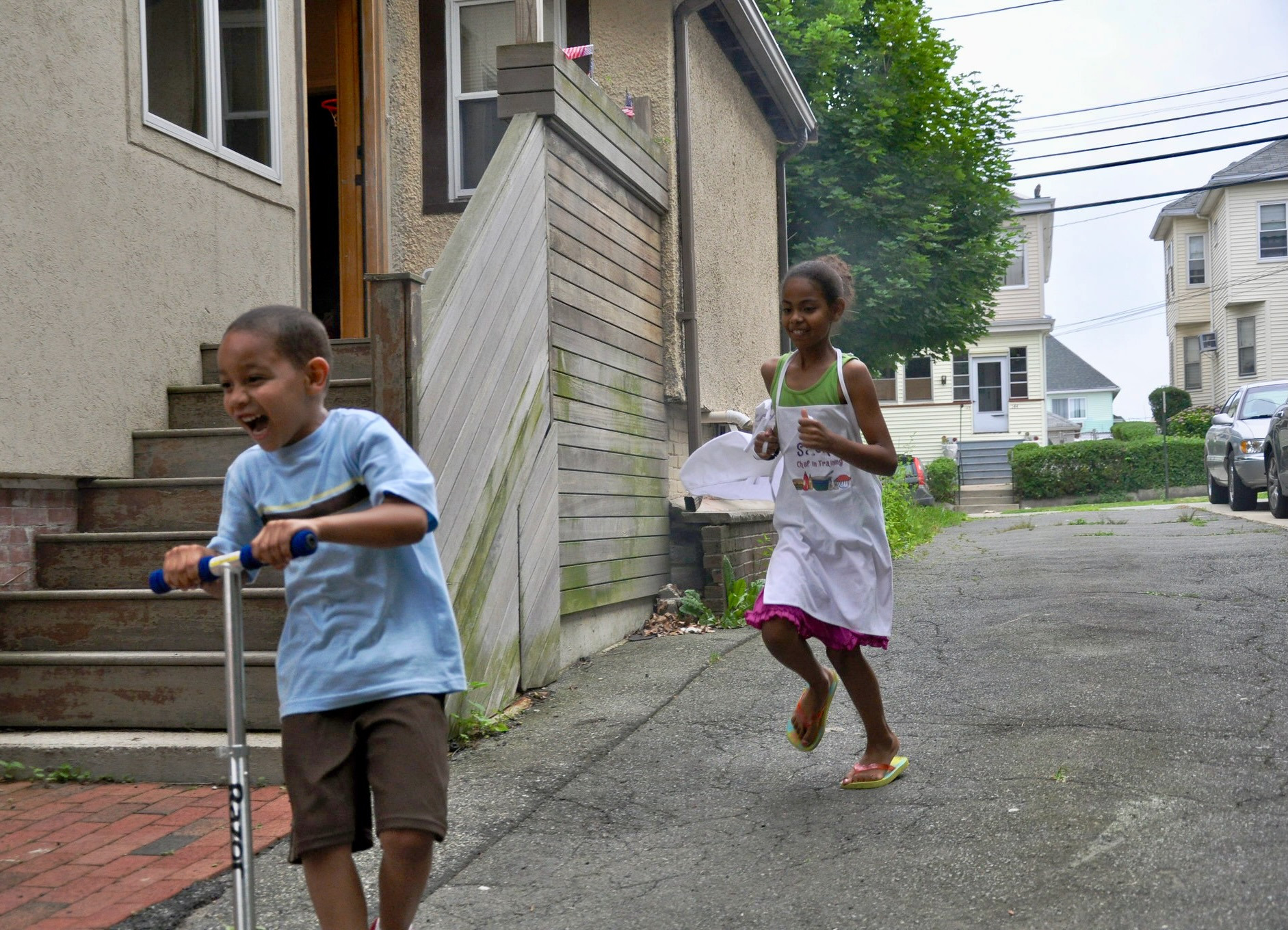 Sasha and Zachary playing outside with a better view of the kitchen door and window where Chris once gritted his teeth and growled 3