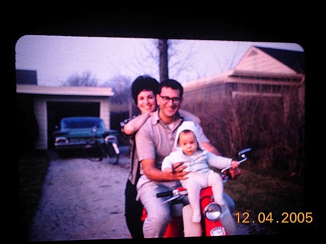 Steve and his parents on a scooter when he was 1 year old